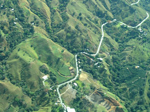 In flight: road through mountains