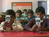 Children from rural India learning with our literacy learning games on cellphones.