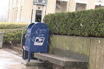 A mailbox on a snowy day