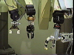 A picture of a pneumatic gripper, the Odetics Hand, a 3-fingered, 
reconfigurable gripper, and the Utah/MIT Hand