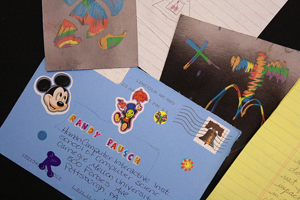 Children often reached out with hand-drawn pictures or cards decorated artwork of the Disney characters that Pausch loved.