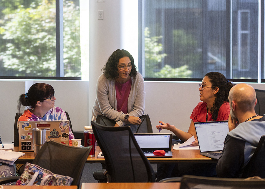 Prof. Rosenthal speaking with teachers at the workshop in 2022.