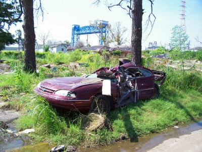 A messed-up car in the 9th Ward.