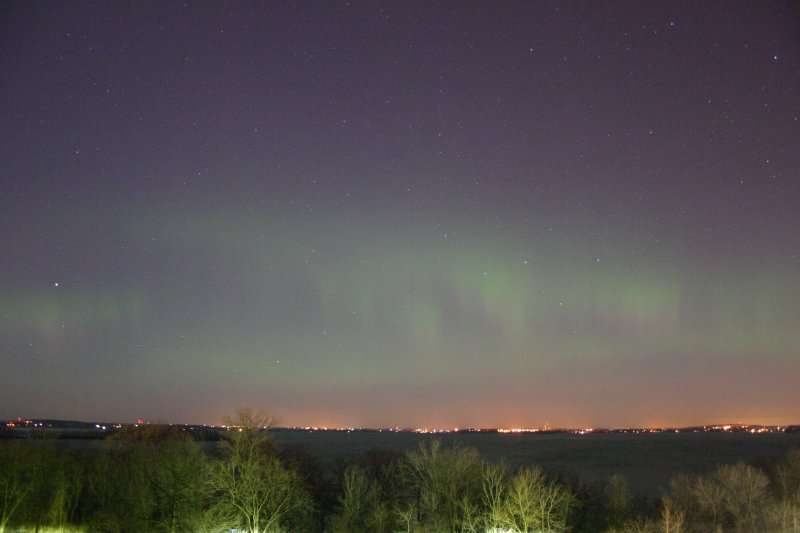 The whole aurora started to pulsate at a frequency of about 3Hz, and the structure became less well-defined.  I took this photo from Washburn observatory looking down at lake Mendota.