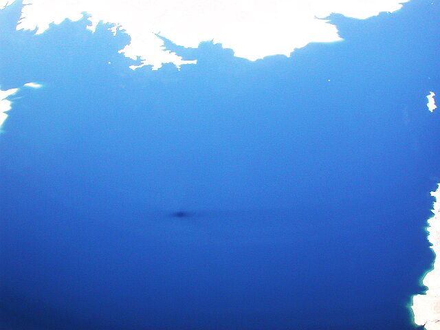 Jetliner shadow over lake Mead.  