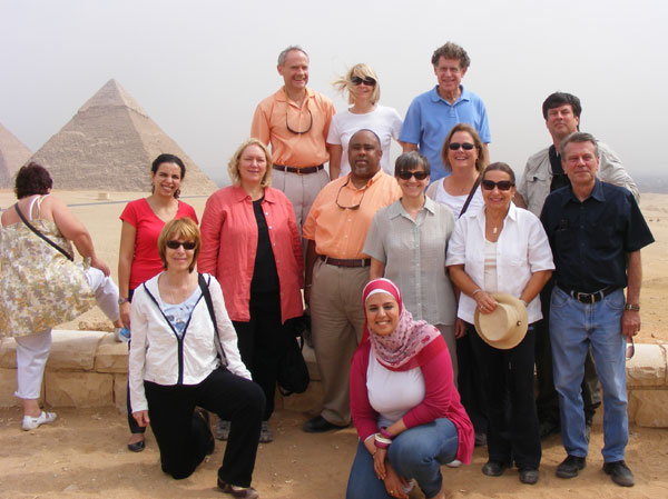 International teachers posing as a group in front of the Pyramids, Egypt