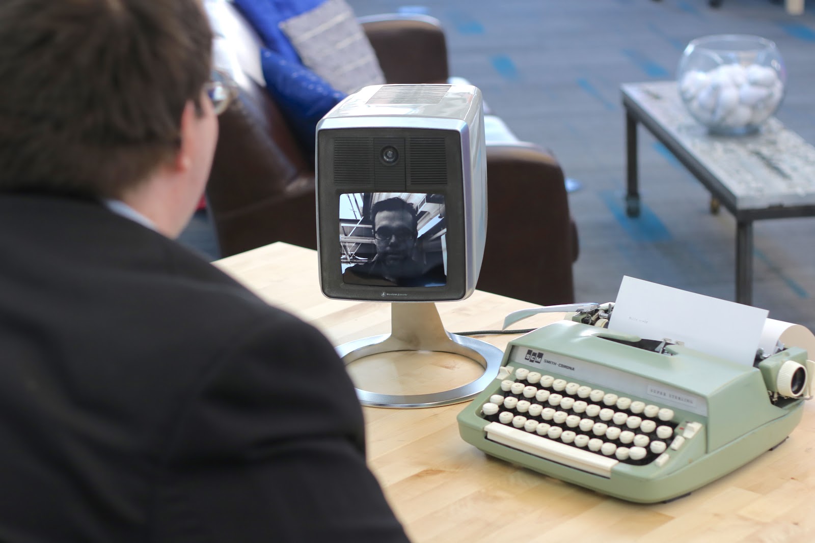 Man recreating the first video call in a demo.