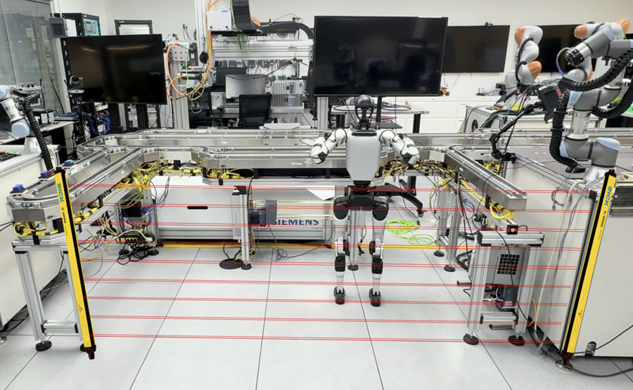  A humanoid robot stands in a lab environment.