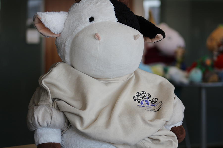 A stuffed black and white cow.