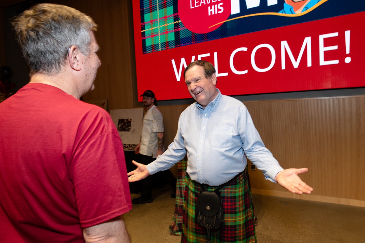 Mark greeting a partygoer at the Stehlik Leaves His Mark Celebration on April 5, 2025.